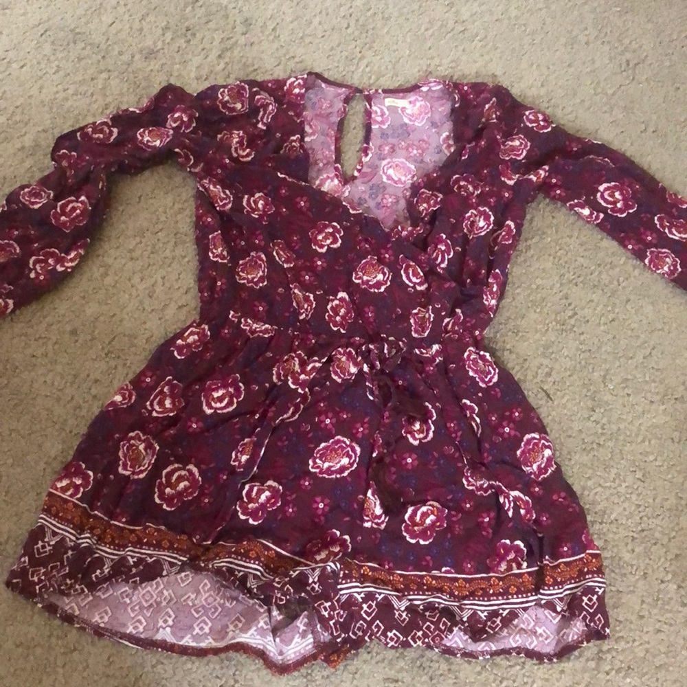 This is a flower maroon romper